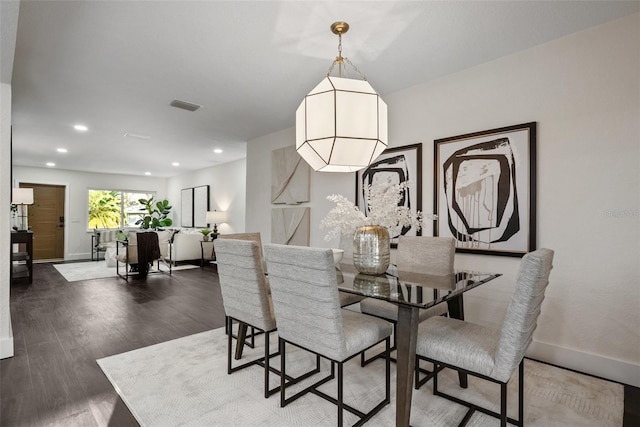 dining room featuring recessed lighting, wood finished floors, visible vents, and baseboards