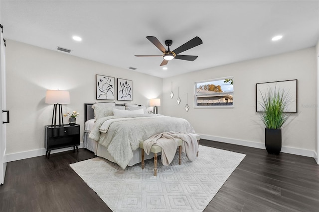 bedroom featuring recessed lighting, dark wood finished floors, visible vents, and baseboards