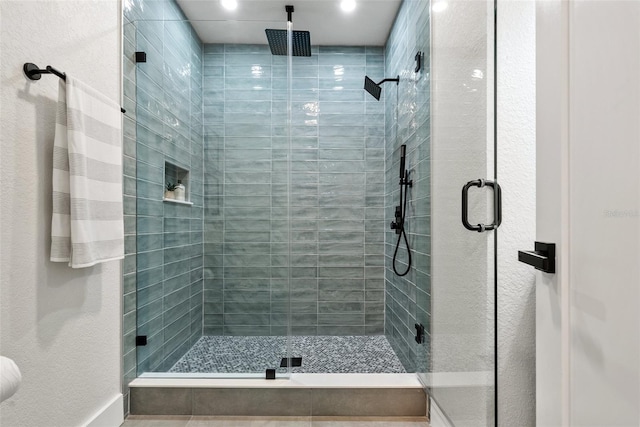 bathroom featuring a shower stall