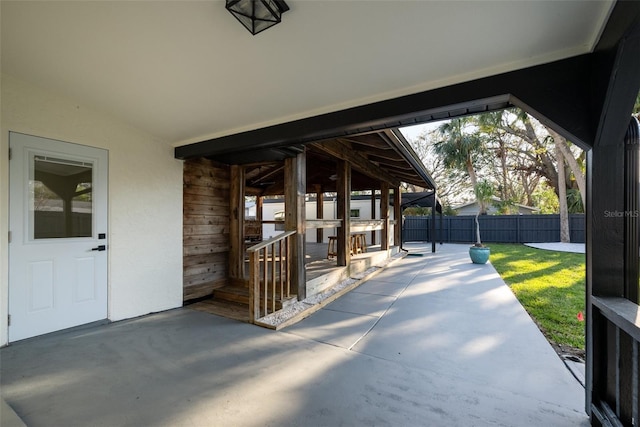 view of patio / terrace featuring fence