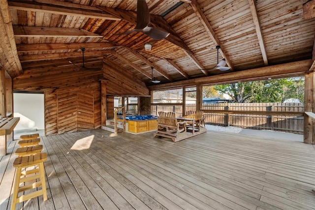 deck featuring ceiling fan and fence