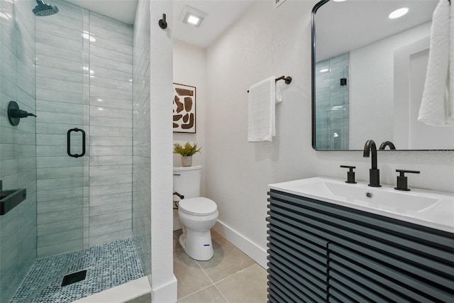 bathroom with a stall shower, a sink, toilet, and tile patterned floors