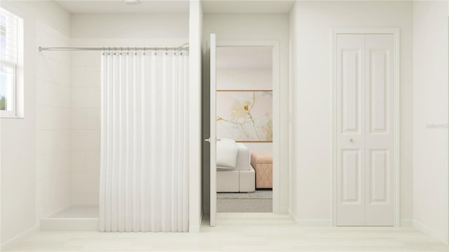 bathroom with a shower with curtain