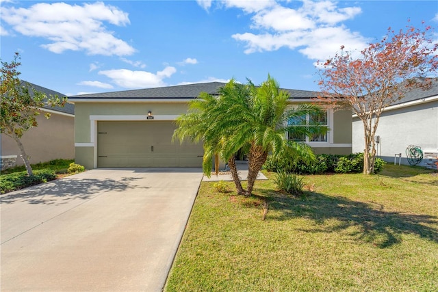 view of front of property featuring a garage and a front yard