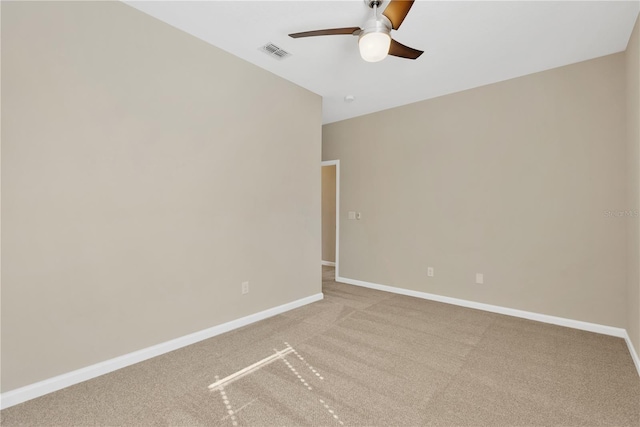 unfurnished room with ceiling fan and carpet flooring