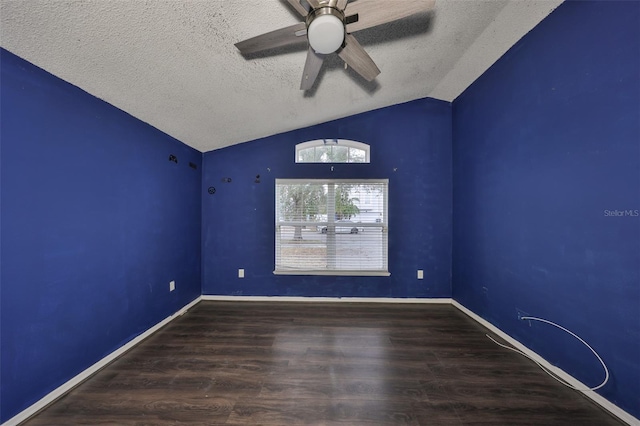 unfurnished room featuring hardwood / wood-style floors, vaulted ceiling, a textured ceiling, and ceiling fan