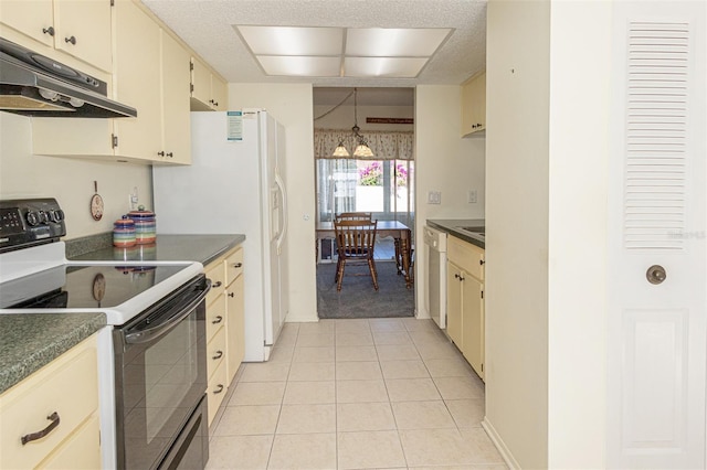 kitchen with white dishwasher, light tile patterned floors, electric range, and cream cabinetry