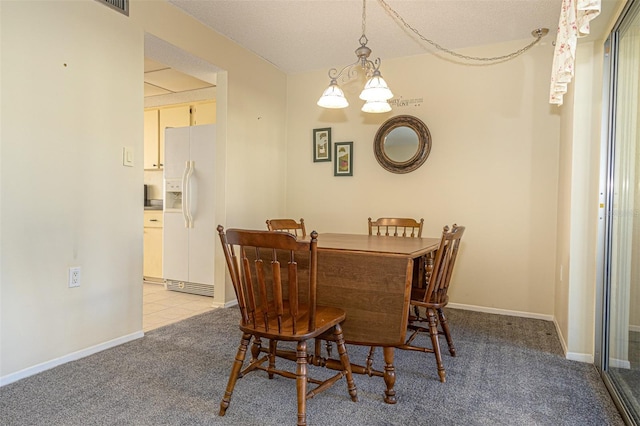 dining room featuring light colored carpet