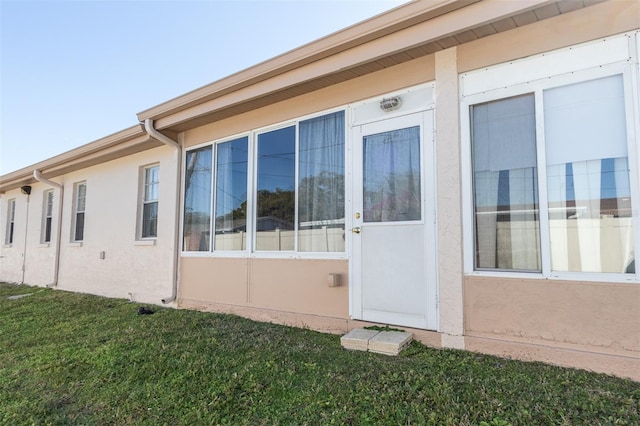 view of side of home featuring a lawn