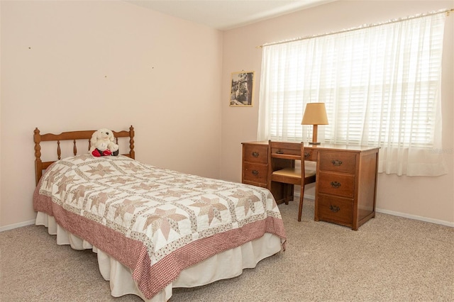 bedroom featuring light carpet