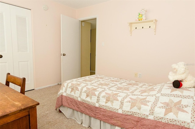 bedroom with light carpet and a closet