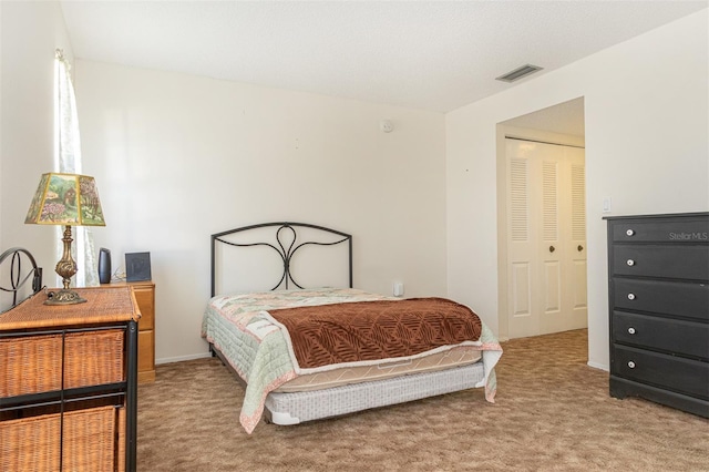 bedroom featuring carpet floors and a closet