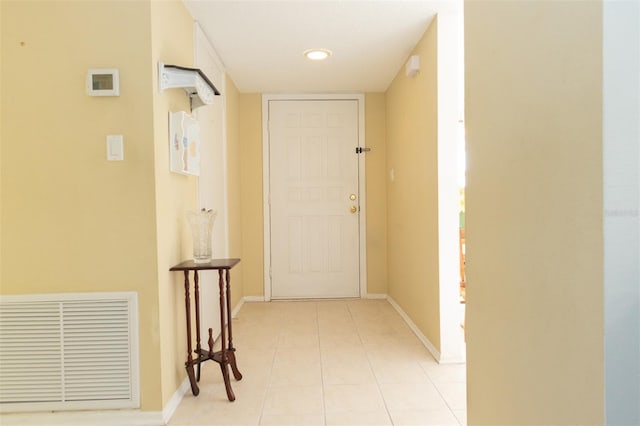 hall with light tile patterned flooring