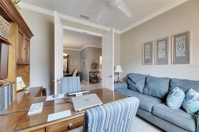 living room with ornamental molding and ceiling fan