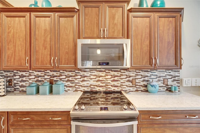 kitchen featuring tasteful backsplash and stainless steel appliances