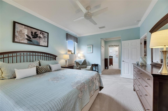 bedroom with ornamental molding, light colored carpet, and ceiling fan