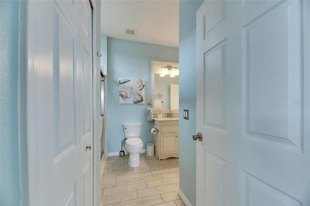 bathroom with vanity and toilet