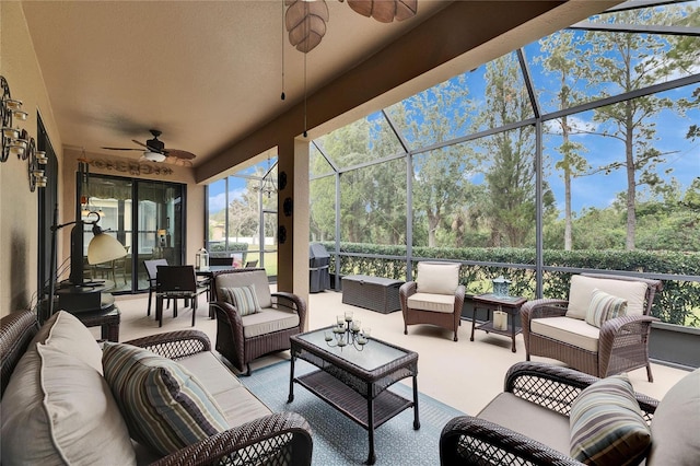 sunroom with ceiling fan