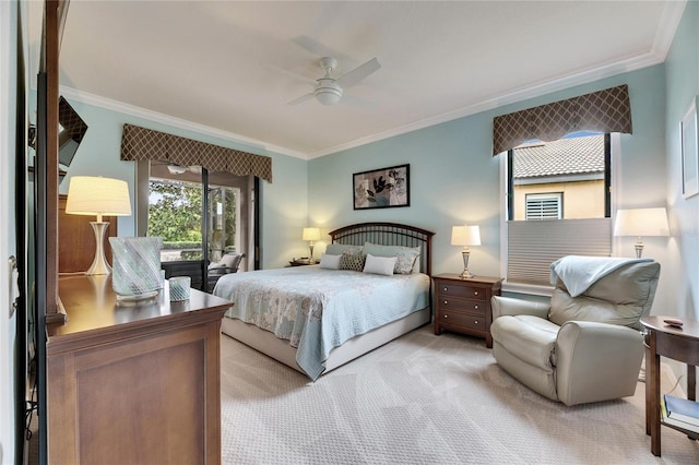 carpeted bedroom featuring ornamental molding and ceiling fan