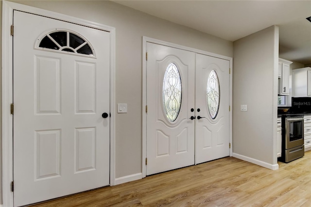 entrance foyer with light hardwood / wood-style floors