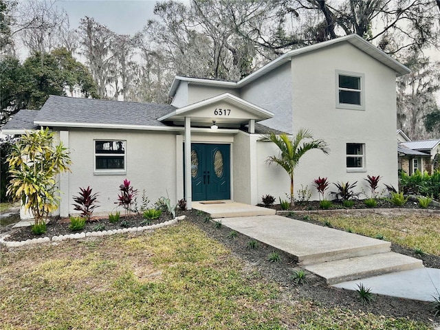 view of front facade featuring a front yard