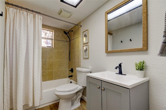 full bathroom featuring shower / bath combination with curtain, vanity, wood-type flooring, and toilet