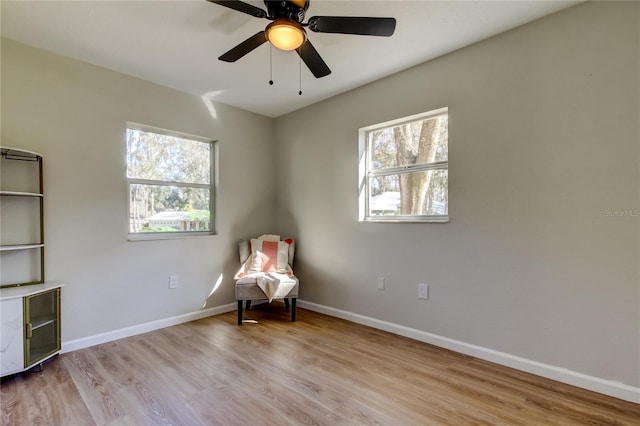 unfurnished room featuring light wood-type flooring and ceiling fan