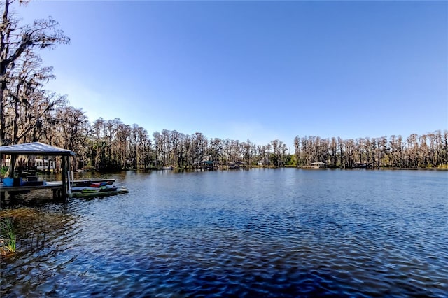 exterior space featuring a water view and a gazebo