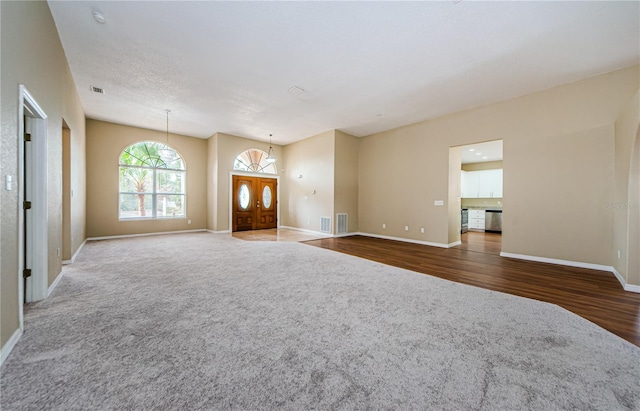 unfurnished living room featuring dark hardwood / wood-style floors