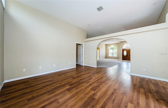 unfurnished room with dark hardwood / wood-style floors