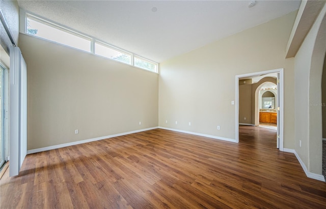 spare room with dark wood-type flooring