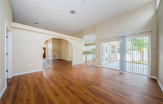 unfurnished living room with hardwood / wood-style flooring