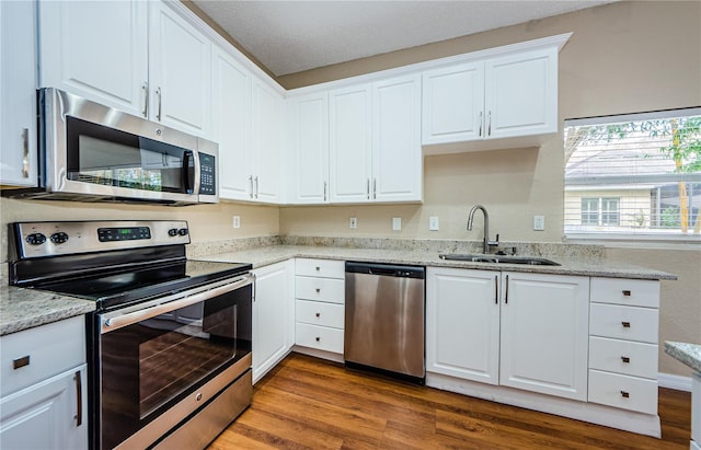 kitchen featuring white cabinetry, sink, and stainless steel appliances