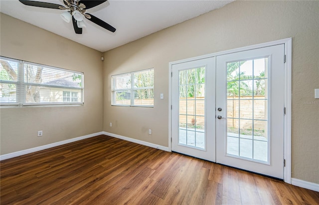 doorway to outside featuring dark wood-type flooring, french doors, and ceiling fan