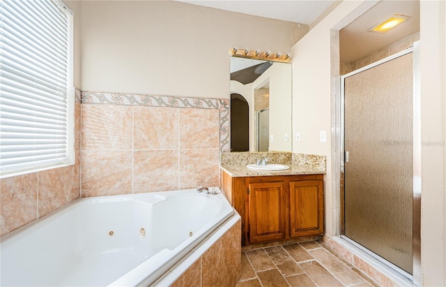 bathroom with plus walk in shower and vanity