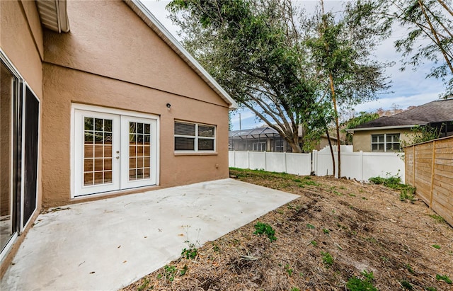 view of yard with french doors and a patio area