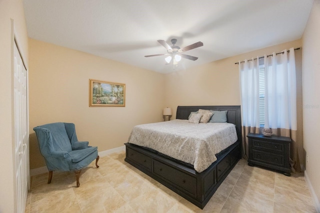 bedroom with ceiling fan and a closet