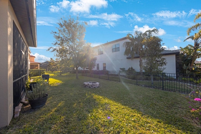 view of yard featuring a fire pit