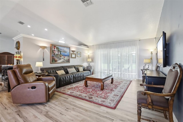 living room with crown molding, vaulted ceiling, and light hardwood / wood-style flooring