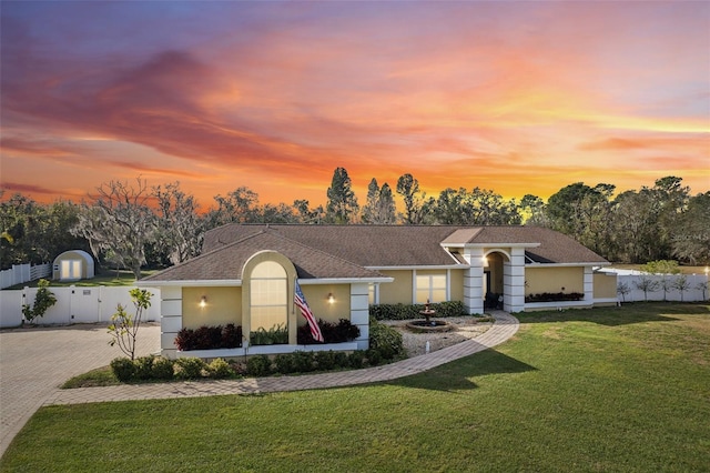 ranch-style house with a yard