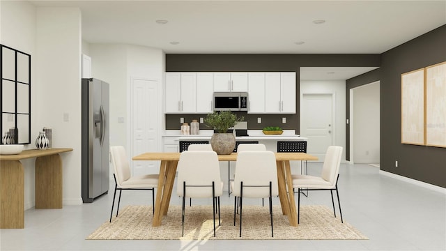 kitchen with white cabinetry, light tile patterned floors, and appliances with stainless steel finishes