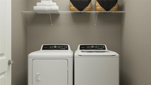 washroom featuring washer and clothes dryer