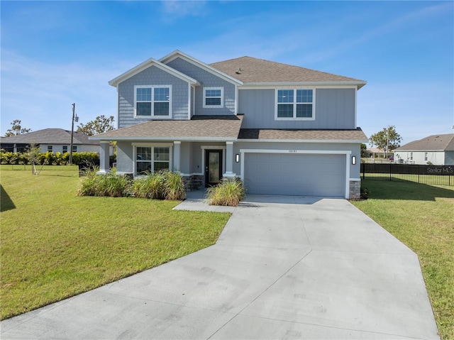 view of front facade with a garage and a front lawn