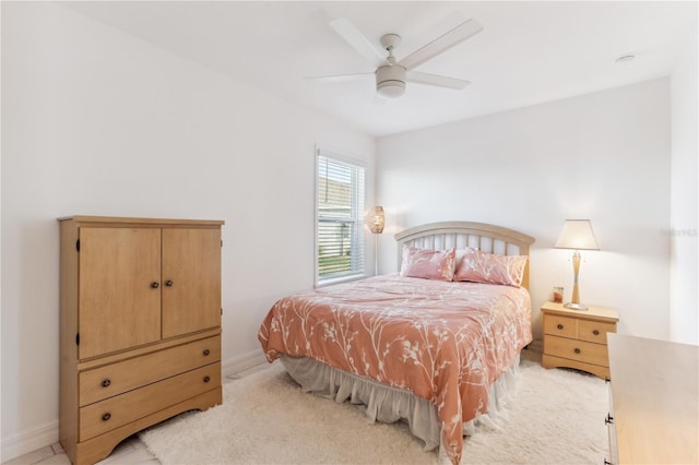 bedroom with light colored carpet and ceiling fan