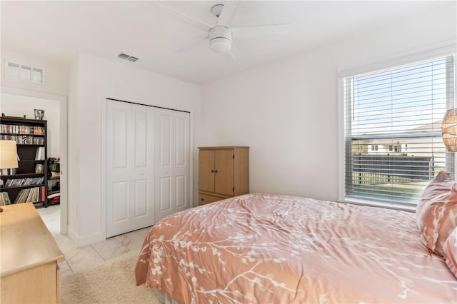 bedroom with a closet and ceiling fan