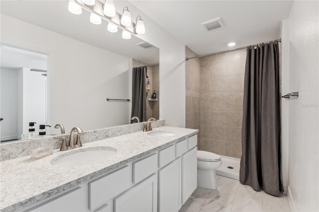 bathroom with vanity, toilet, and walk in shower