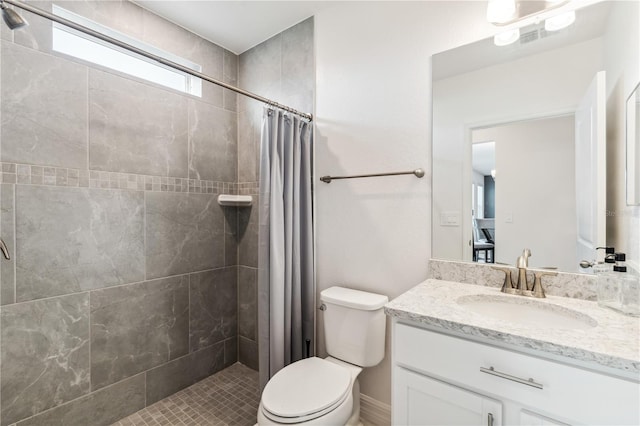 bathroom featuring vanity, a shower with curtain, and toilet