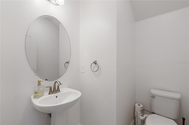 bathroom featuring sink and toilet