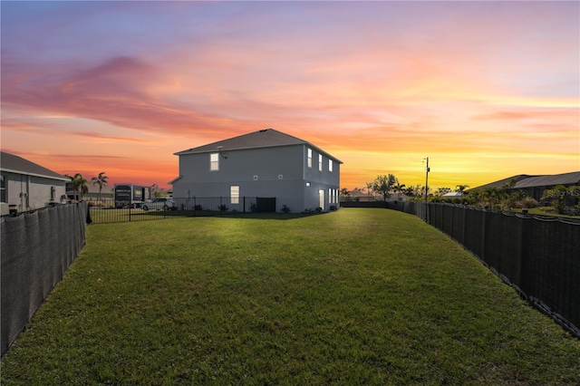 view of yard at dusk