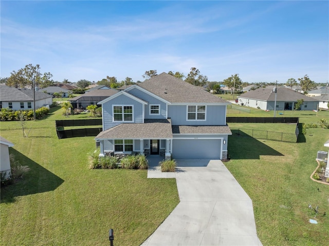 view of front of property featuring a garage, a porch, and a front yard